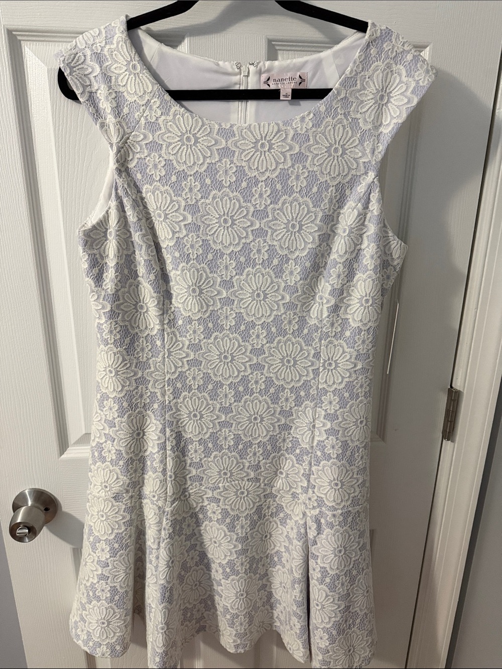 This is a Nanette Lepore cap-sleeve lace dress featuring a delicate white floral